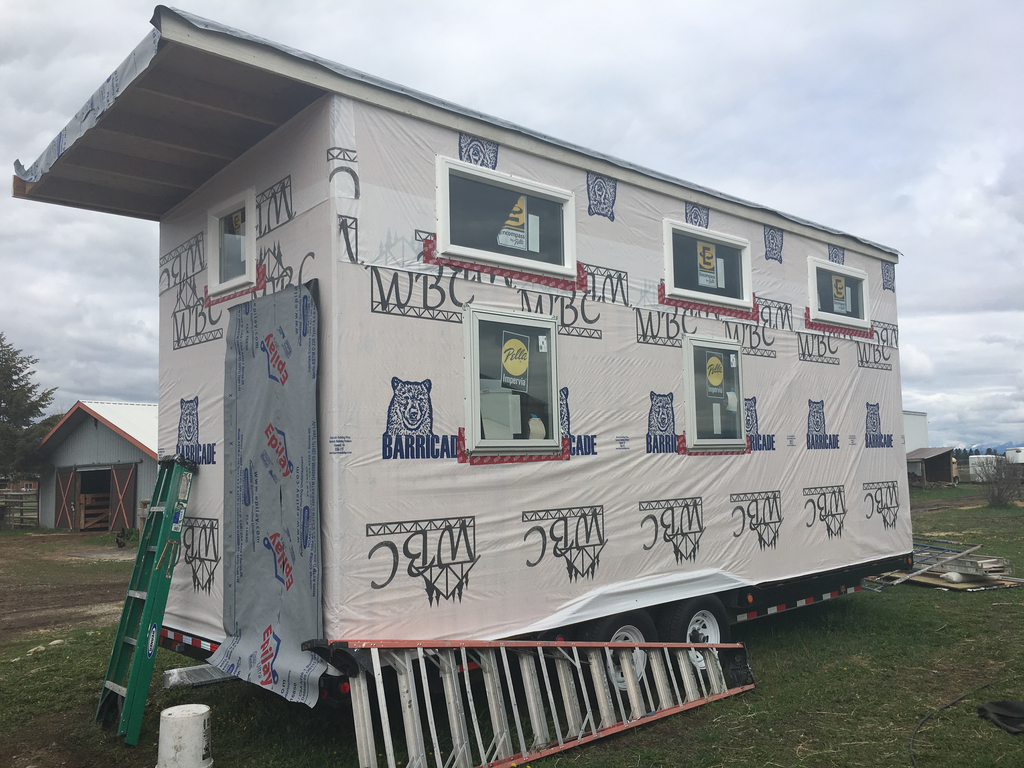 IT'S GETTING DRESSED: WINDOWS IN, HOUSE WRAP ON
