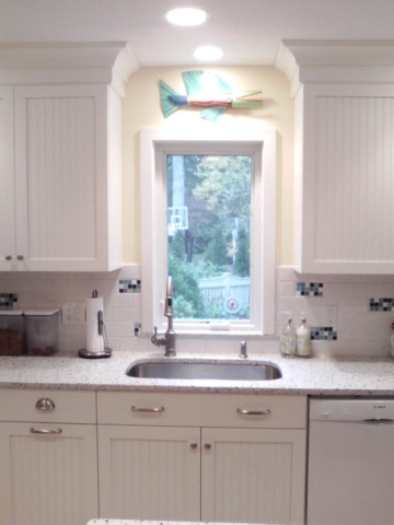 AFTER: A SMALLER WINDOW CREATES PRIVACY AND ADDS MORE WALL CABINETS